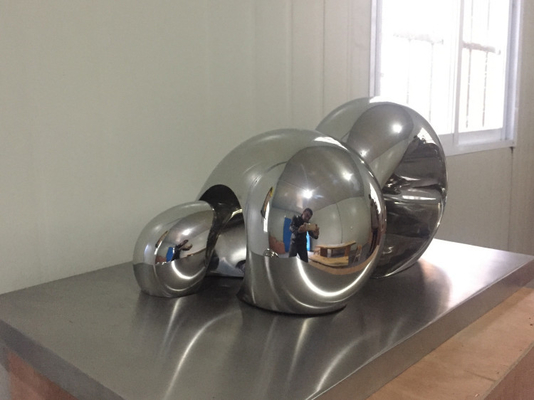 O espelho abstrato das esculturas da decoração da casa do OEM lustrou a escultura de aço inoxidável